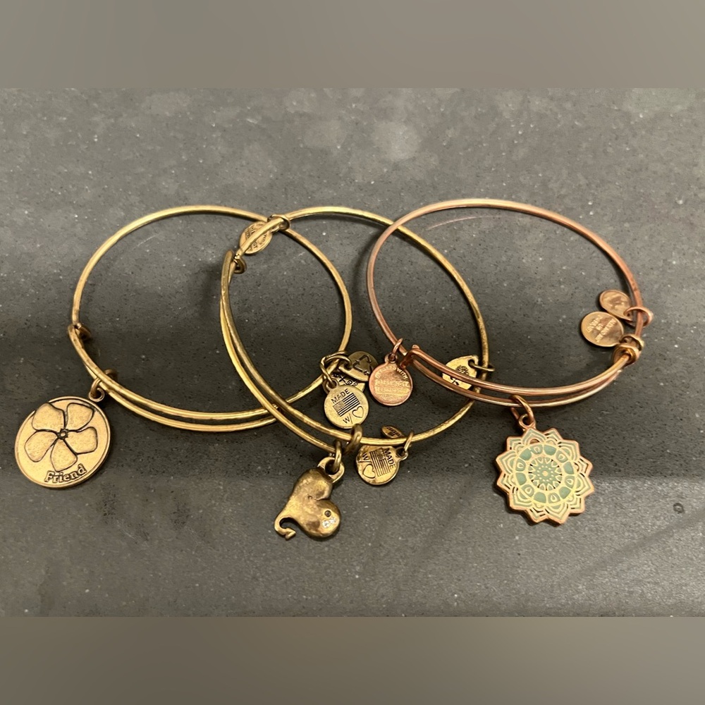 3 of my favorite Alex & Ani charm bracelets in perfect condition.